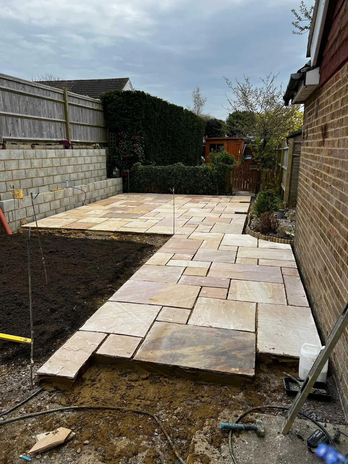 Indian sandstone patio installation in progress Kent